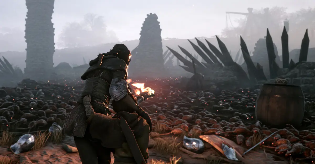 Amicia usando uma tocha para repelir enxames de ratos em A Plague Tale Innocence