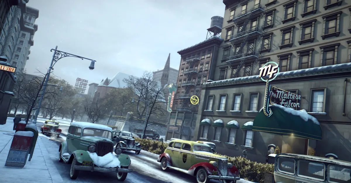 Vito Scaletta a caminhar por uma rua coberta de neve em Empire Bay em Mafia II: Definitive Edition