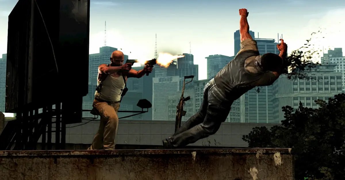 Max Payne a saltar pelo ar em câmara lenta enquanto dispara com duas pistolas numa favela.