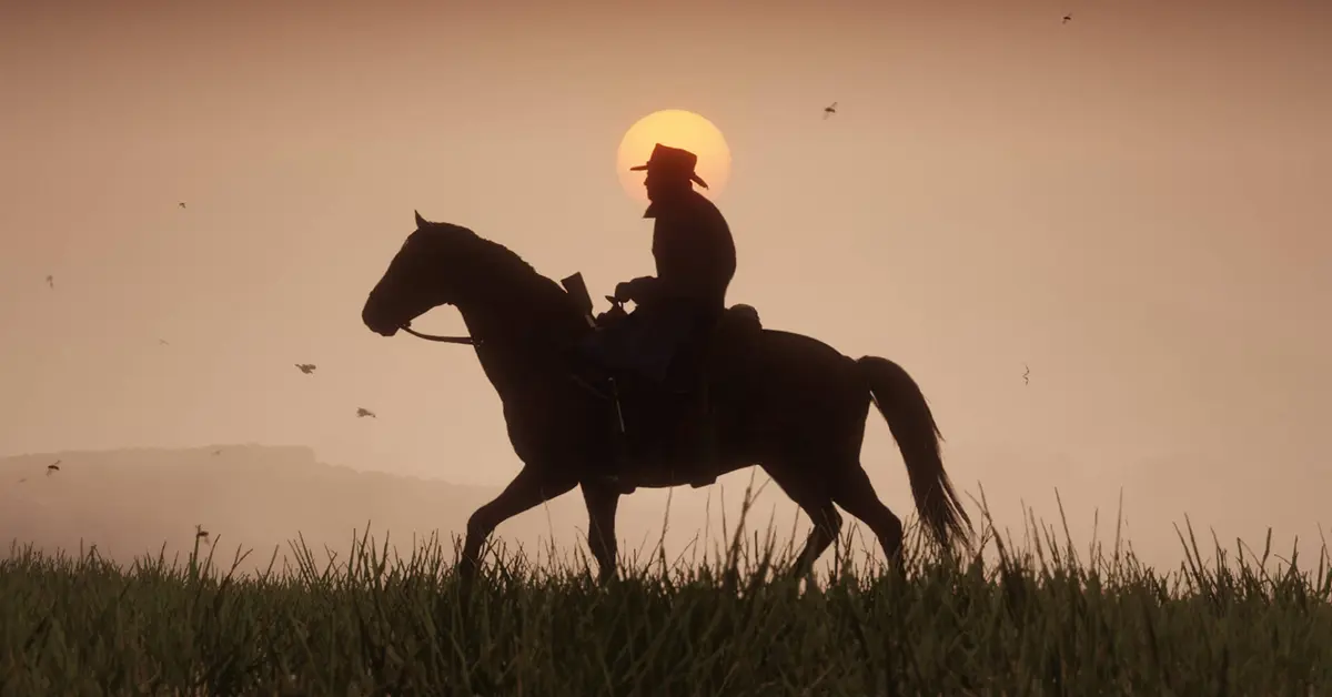 Arthur Morgan a cavalo durante um pôr do sol em Red Dead Redemption 2.